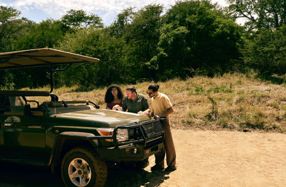 people on a truck in african safari - club med